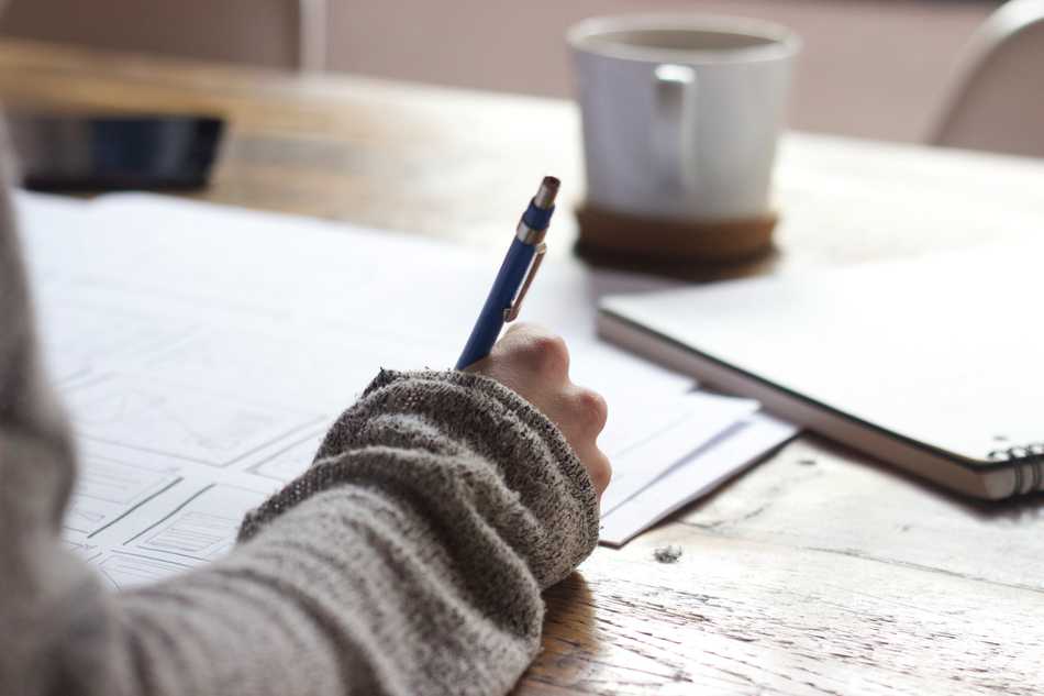 Photo of someone diagramming on a sheet of paper